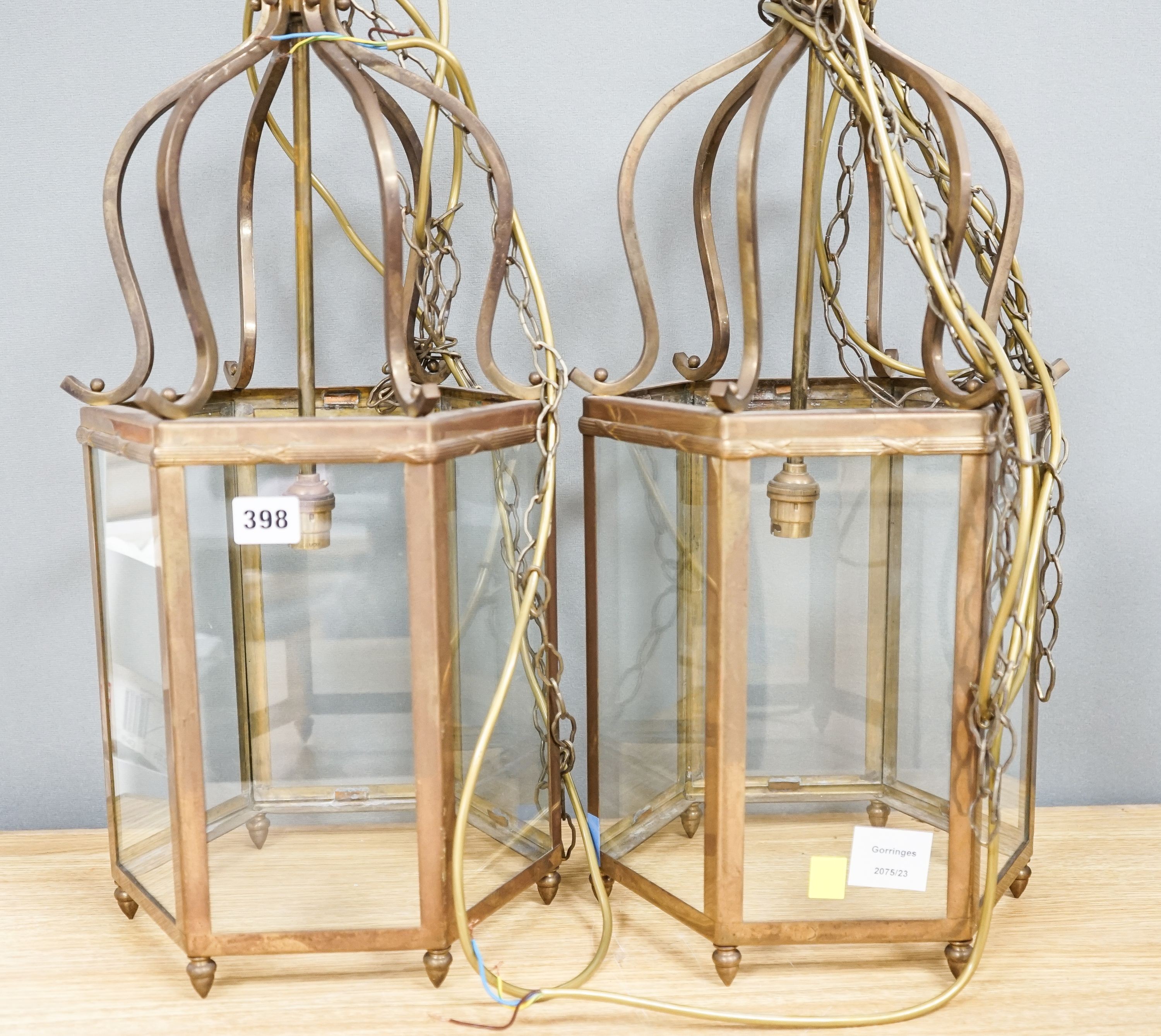 A pair of brass hexagonal lanterns 54cm